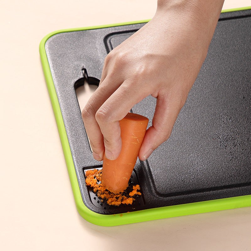 Planche à découper 4 en 1 multifonctions pour couper, râper, aiguiser et décongeler avec design pratique et bord vert.