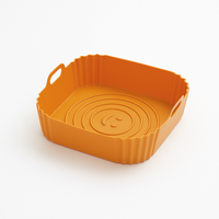 Moule en silicone orange carré antiadhésif pour airfryer, léger et réutilisable, idéal pour cuisiner proprement.
