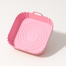 moule en silicone anti-adhésif et réutilisable pour airfryer de couleur rose avec poignée ergonomique