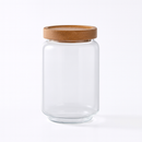 Bocal en verre transparent avec couvercle en bois hermétique pour rangement élégant en cuisine.
