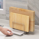 Support planche à découper double barres en métal avec plateaux pour rangement organisé de planches et accessoires de cuisine.