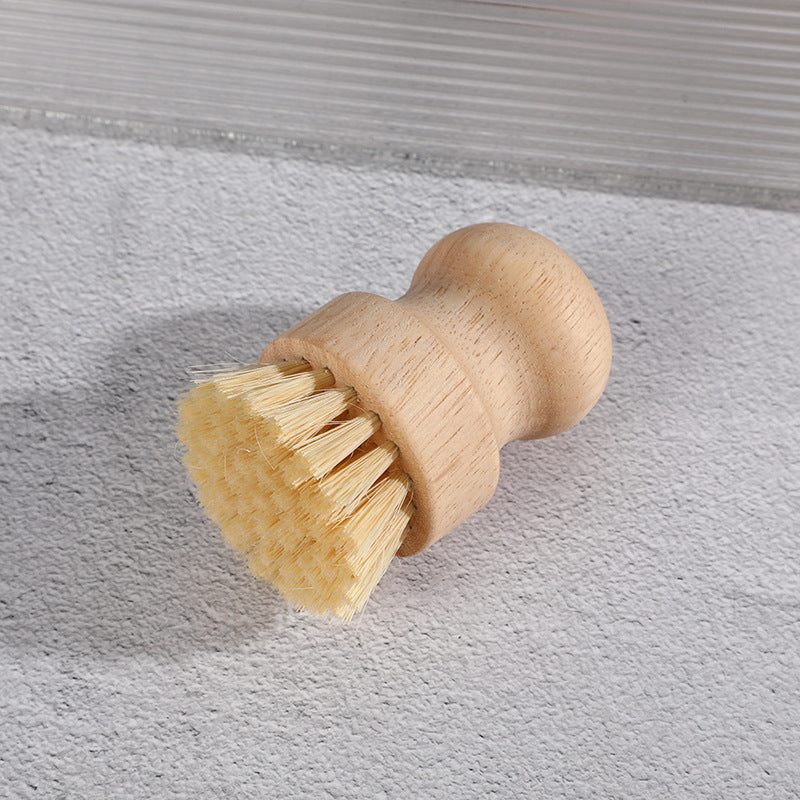 Brosse à vaisselle en bambou avec poignée en bois confortable et fibres robustes pour un nettoyage doux et efficace sans plastique.