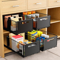 Organisateur de tiroir coulissant métallique noir pour cuisine, rangement ordonné avec poignées ergonomiques et design robuste.