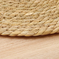 Set de table rond en rotin tressé à la main, naturel et écologique, protège la table avec élégance.