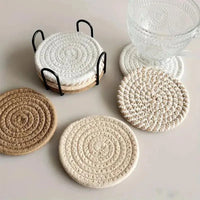 ensemble de 8 sous-verres absorbants en fibres naturelles avec support métallique noir, design rond et épuré pour protection de meubles et décoration intérieure